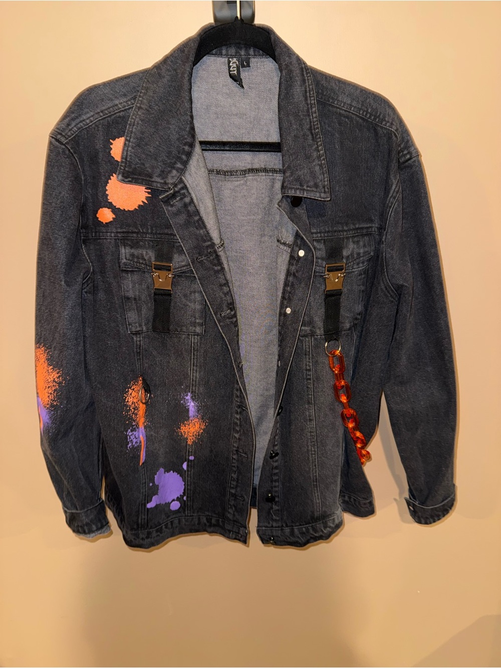 Black Denim Jacket with Attached Orange Chain and Spray Paint Design - GoGuy